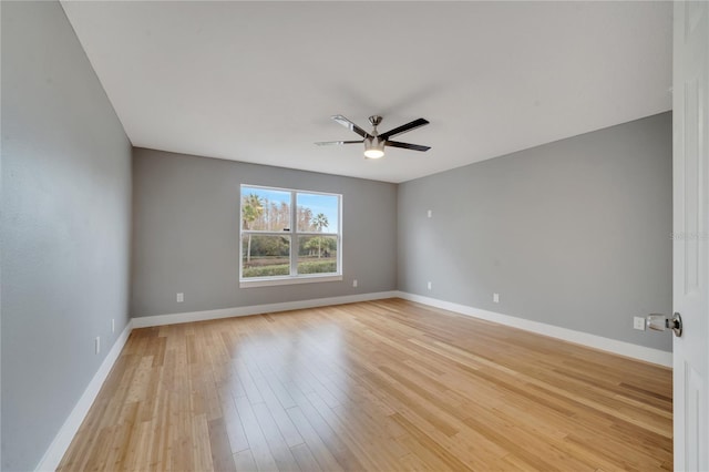 empty room featuring ceiling fan and light wood-type flooring