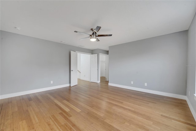 unfurnished bedroom with ceiling fan and light wood-type flooring