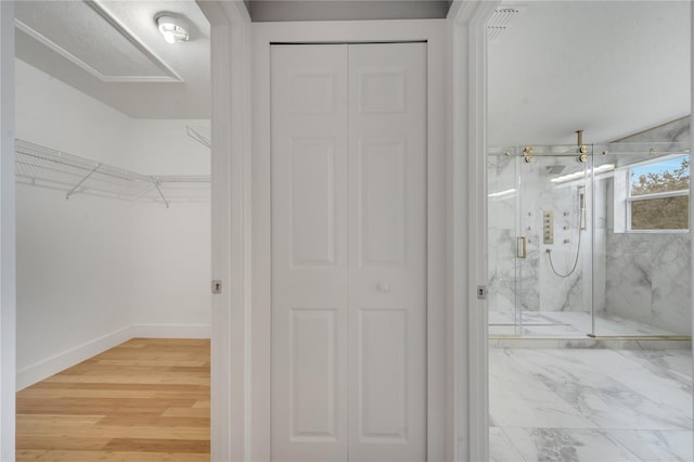 bathroom featuring an enclosed shower