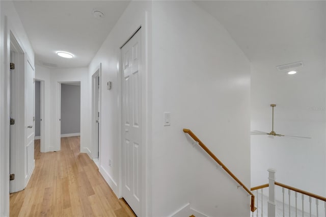 hall with light hardwood / wood-style flooring