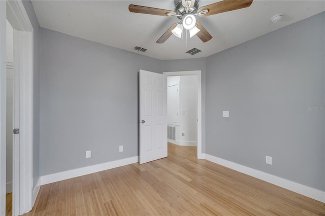 unfurnished bedroom with ceiling fan and light hardwood / wood-style floors