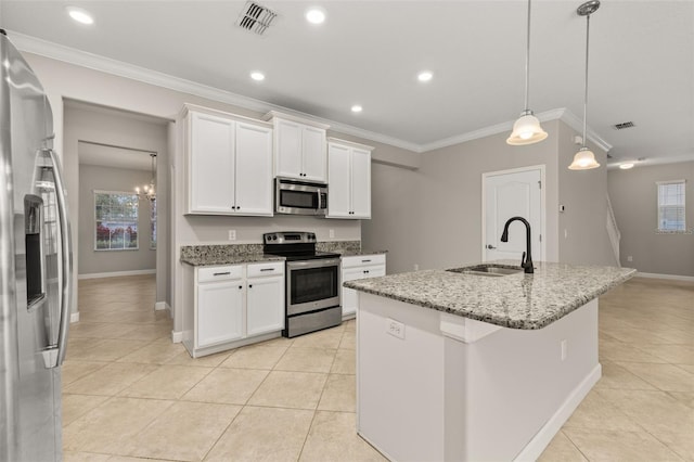 kitchen with a center island with sink, white cabinets, sink, hanging light fixtures, and stainless steel appliances