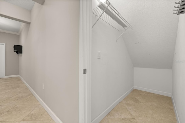 walk in closet featuring light tile patterned floors