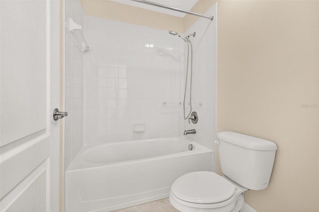 bathroom with shower / washtub combination and toilet