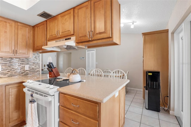 kitchen featuring light stone countertops, tasteful backsplash, a textured ceiling, light tile patterned floors, and white electric range