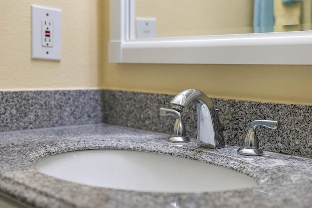 room details featuring tasteful backsplash and sink