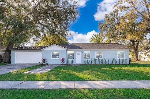 single story home with a garage and a front lawn