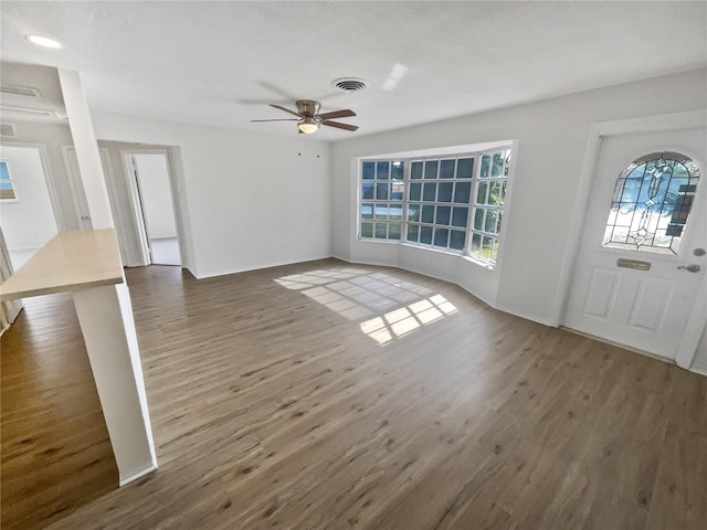 entrance foyer featuring ceiling fan and dark hardwood / wood-style floors