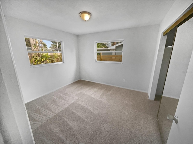 unfurnished bedroom with carpet and a closet