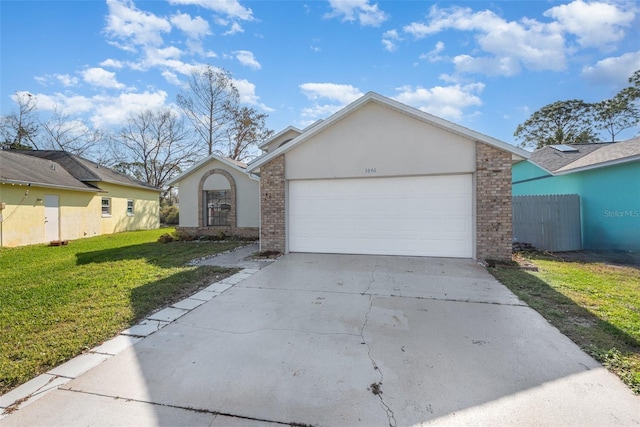 single story home with a garage and a front lawn