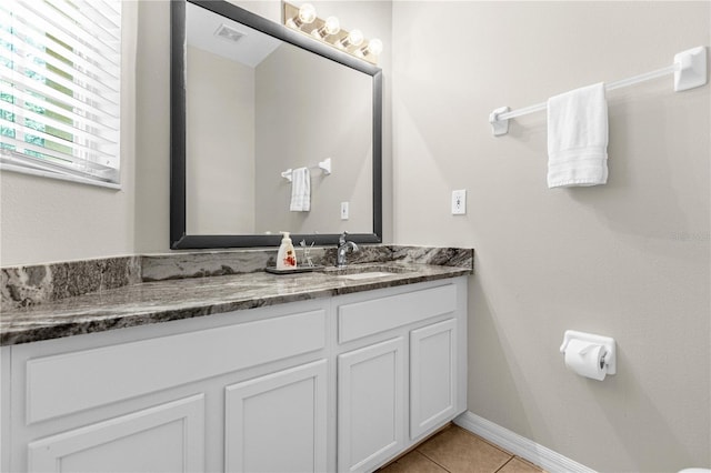 bathroom featuring tile patterned floors and vanity