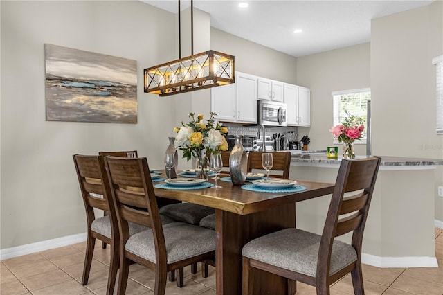 dining space with light tile patterned floors