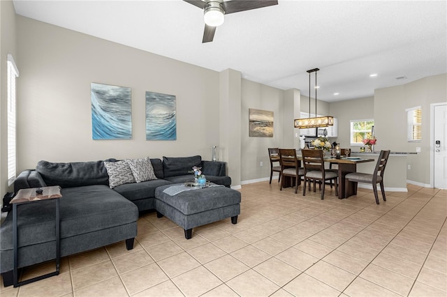 tiled living room with ceiling fan