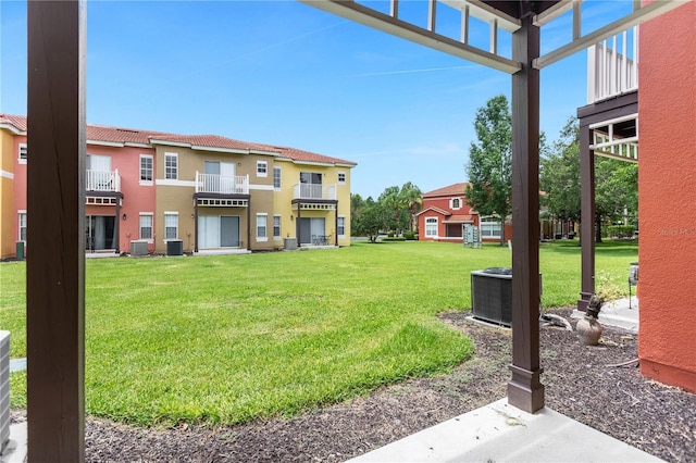 view of yard with central AC