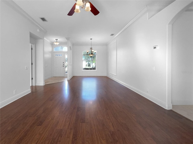 unfurnished living room featuring crown molding, dark hardwood / wood-style flooring, and ceiling fan with notable chandelier