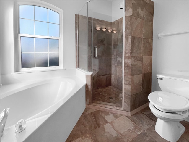 bathroom featuring toilet and plus walk in shower