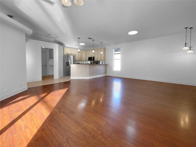 unfurnished living room featuring dark hardwood / wood-style floors