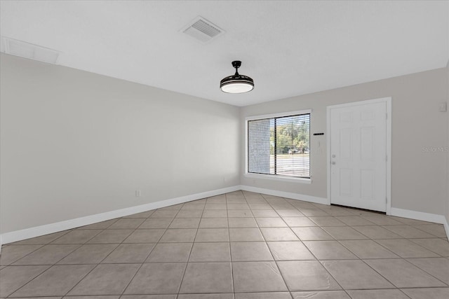 unfurnished room featuring light tile patterned floors