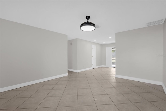 spare room featuring light tile patterned floors