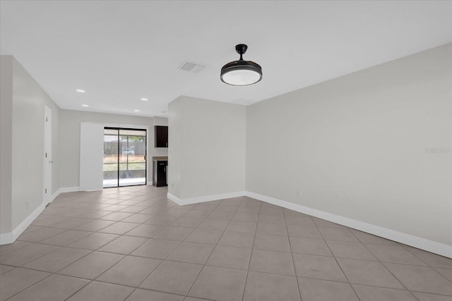 empty room with light tile patterned flooring