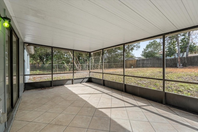 unfurnished sunroom featuring a healthy amount of sunlight