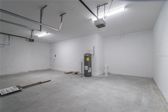 garage with a garage door opener, concrete block wall, and electric water heater