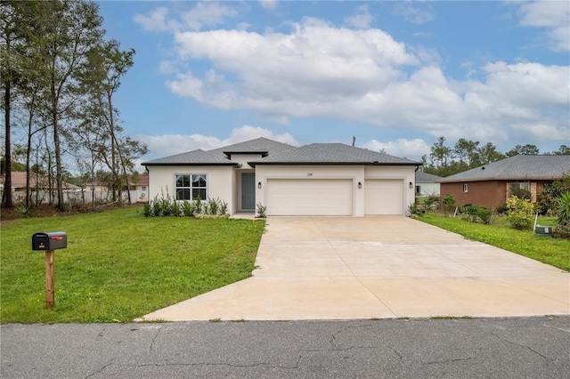 prairie-style house featuring an attached garage, a front lawn, concrete driveway, and stucco siding