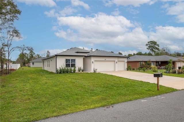 view of front of home with a garage, driveway, a front lawn, and stucco siding