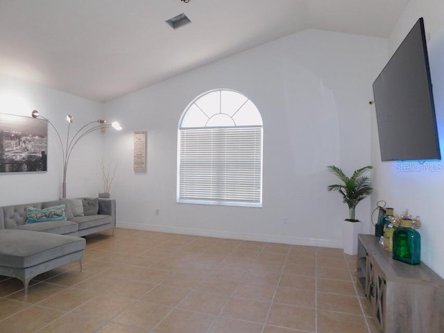 tiled living room featuring lofted ceiling