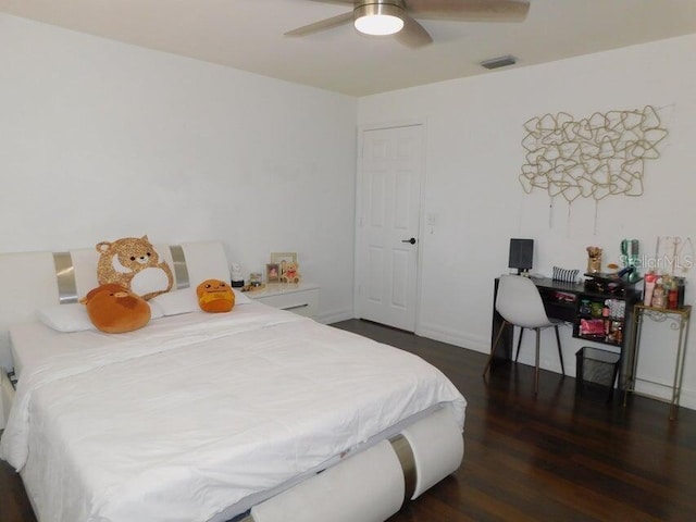 bedroom featuring dark hardwood / wood-style flooring and ceiling fan