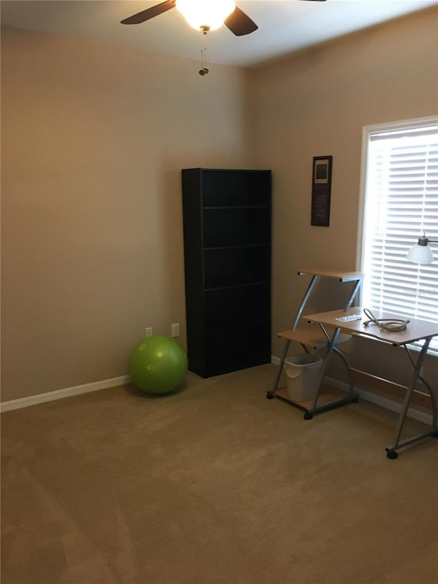 misc room featuring ceiling fan and carpet flooring