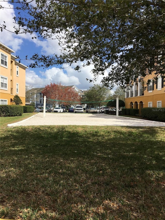 view of yard featuring volleyball court