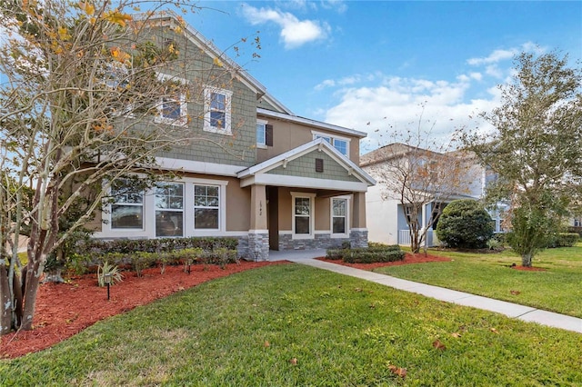 craftsman-style home featuring a front yard