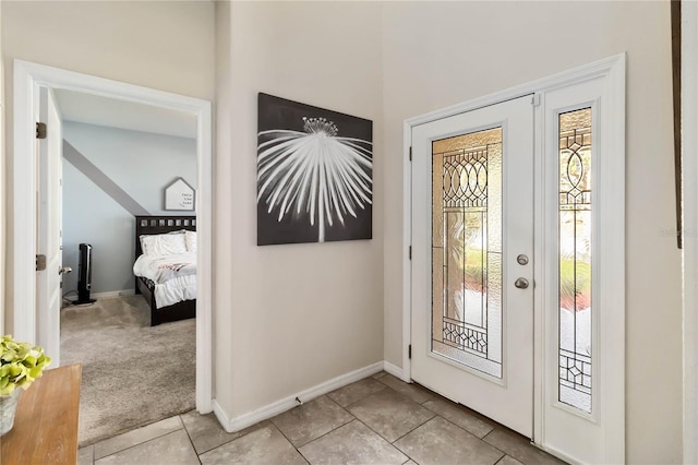 view of carpeted entrance foyer