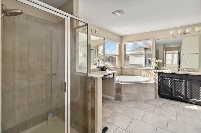 bathroom with tile patterned flooring, shower with separate bathtub, and vanity