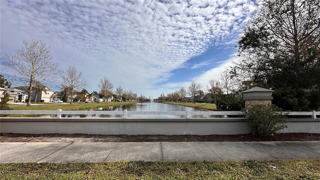 view of home's community with a water view