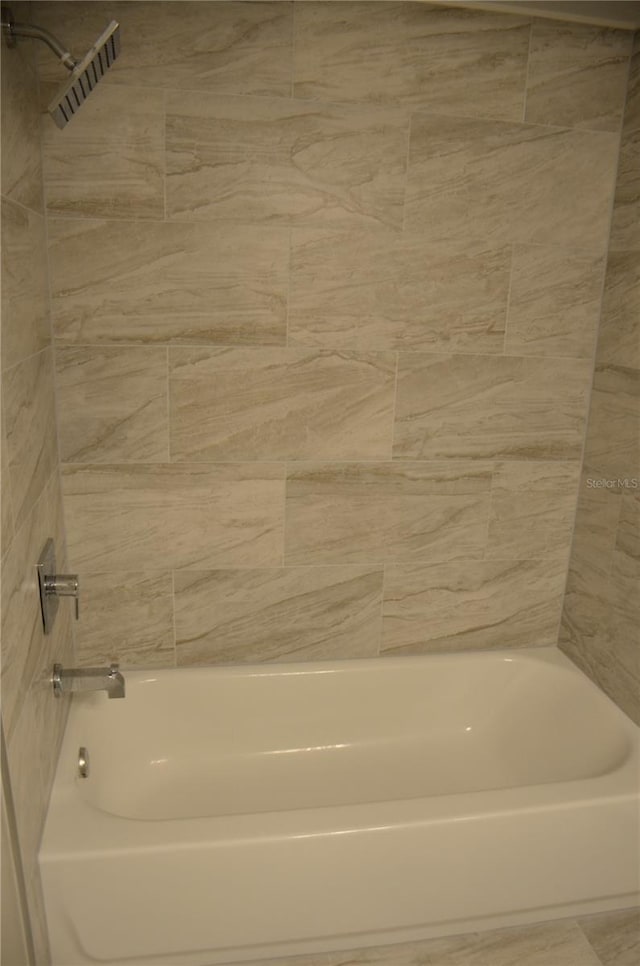 full bathroom with  shower combination and visible vents