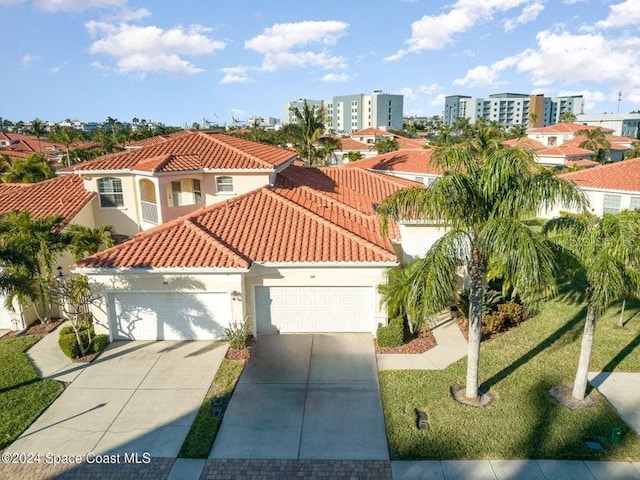 view of front of property featuring a front yard and a garage