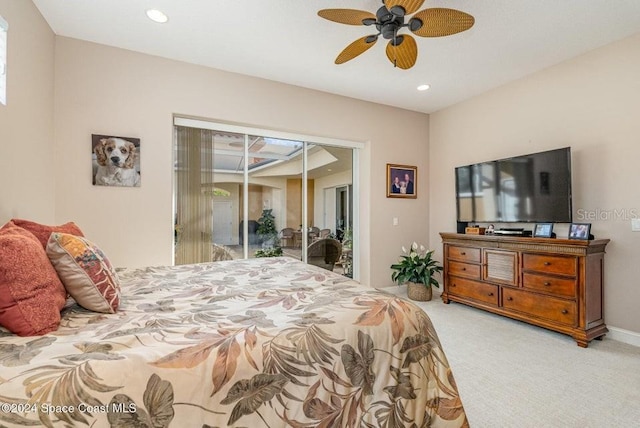 bedroom featuring access to exterior, ceiling fan, a closet, and light carpet