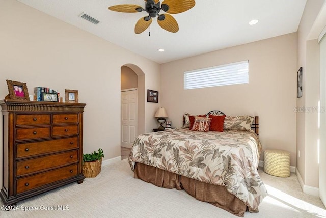 bedroom with light colored carpet and ceiling fan