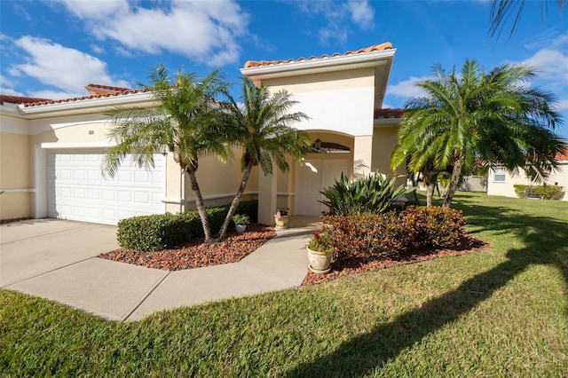 mediterranean / spanish-style house with a garage and a front yard