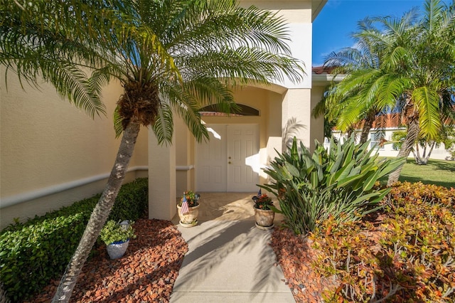 560 Casa Bella Dr Unit 1603, Cape Canaveral, FL 32920 - entrance to property featuring stucco siding