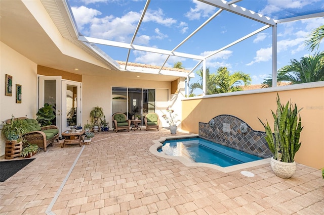 560 Casa Bella Dr Unit 1603, Cape Canaveral, FL 32920 - view of swimming pool featuring a patio area, french doors, and glass enclosure