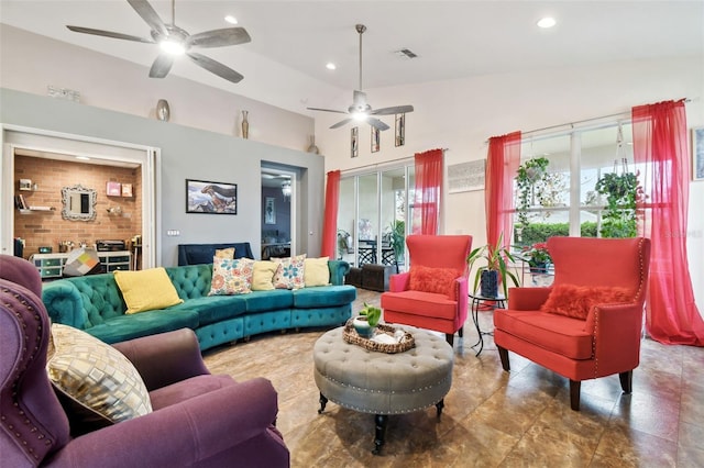 living room featuring ceiling fan and lofted ceiling