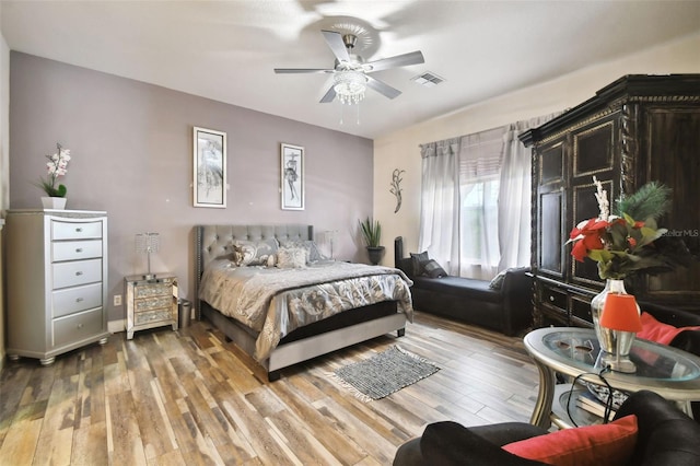 bedroom featuring ceiling fan and wood-type flooring