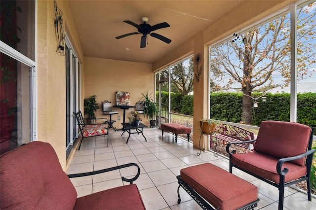 sunroom / solarium with ceiling fan