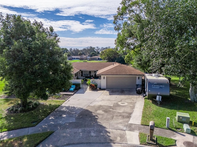 view of front facade with a front lawn and a garage