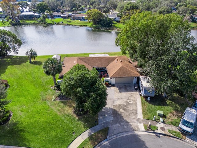 birds eye view of property with a water view