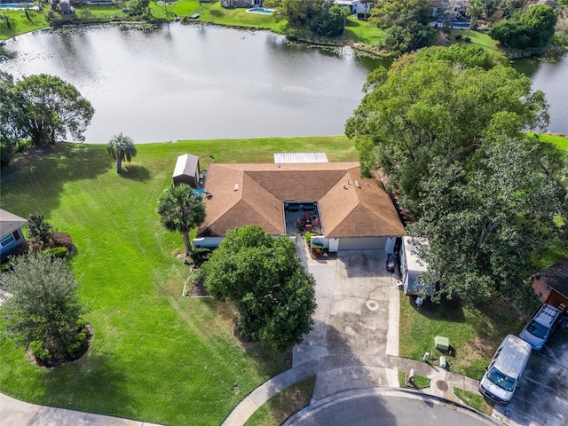 birds eye view of property with a water view