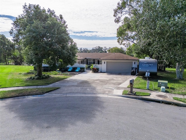 ranch-style house with a front lawn and a garage